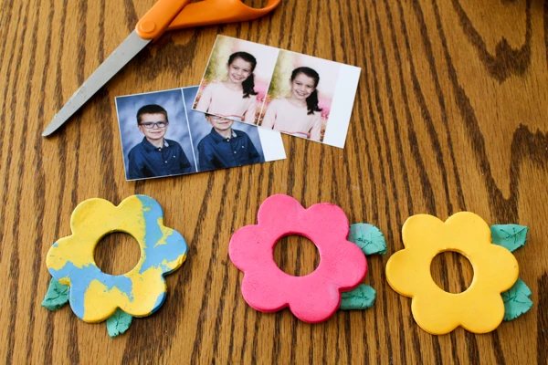 Cut a photo to fit on the back of the air dry clay flower.